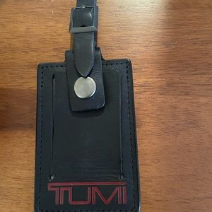 Tumi black leather tag